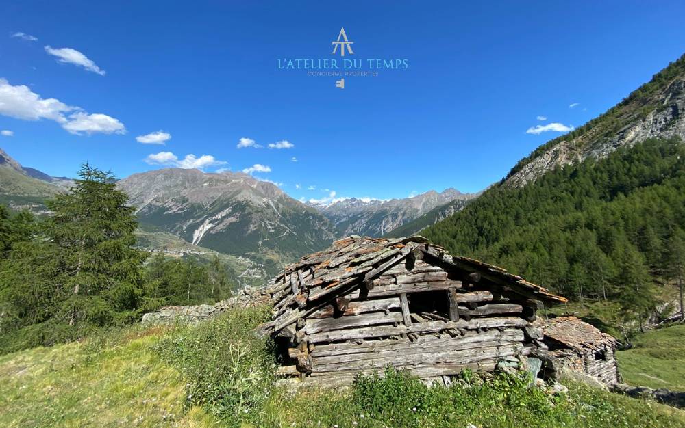 Herbetet Alpine Huts in Gran Paradiso Park, Cogne, with views of the Aosta Valley Alps