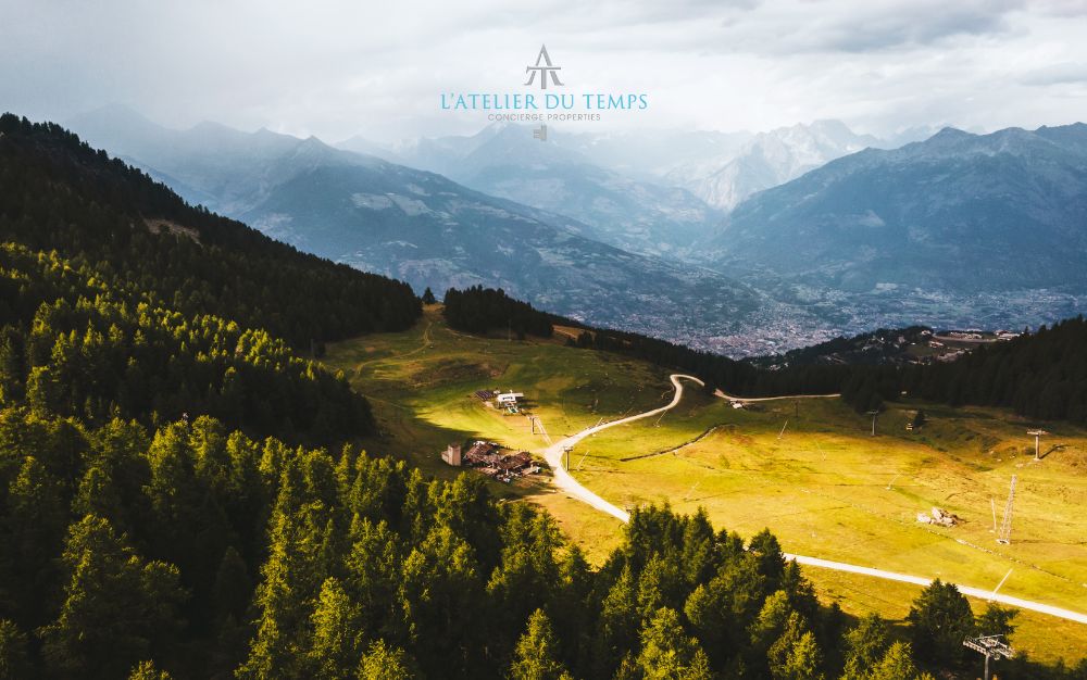 Aerial view of Aosta with the Pila trails and surrounding mountains.
