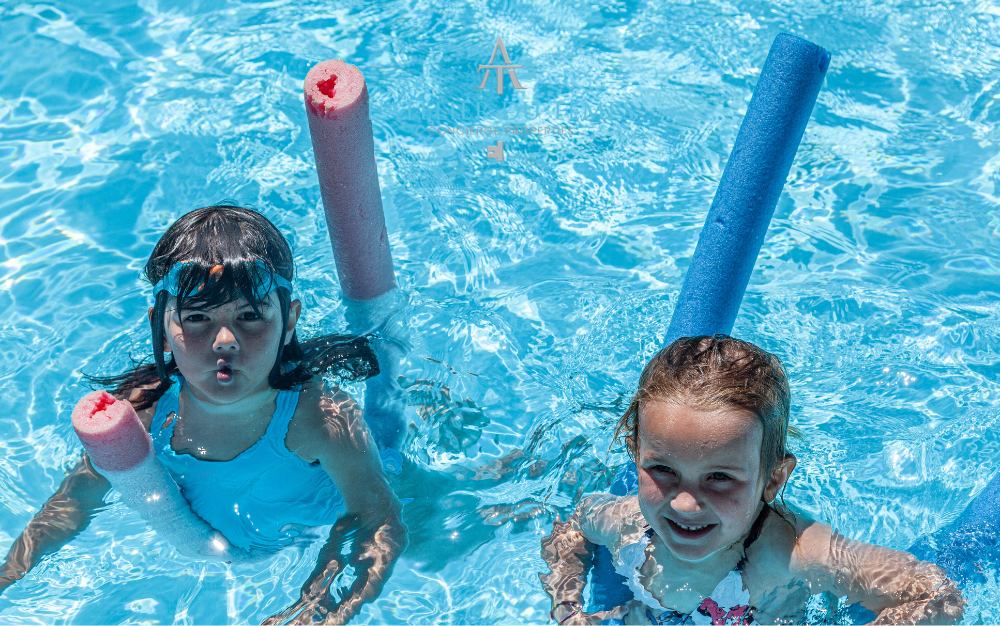 Children at the alpine pool of Plan Checrouit in Courmayeur